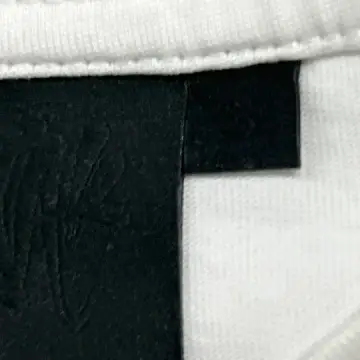 Syna World Tees QC photo
