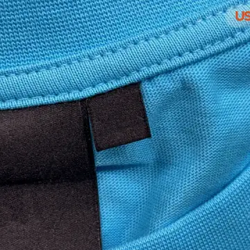 Syna World Tees QC photo